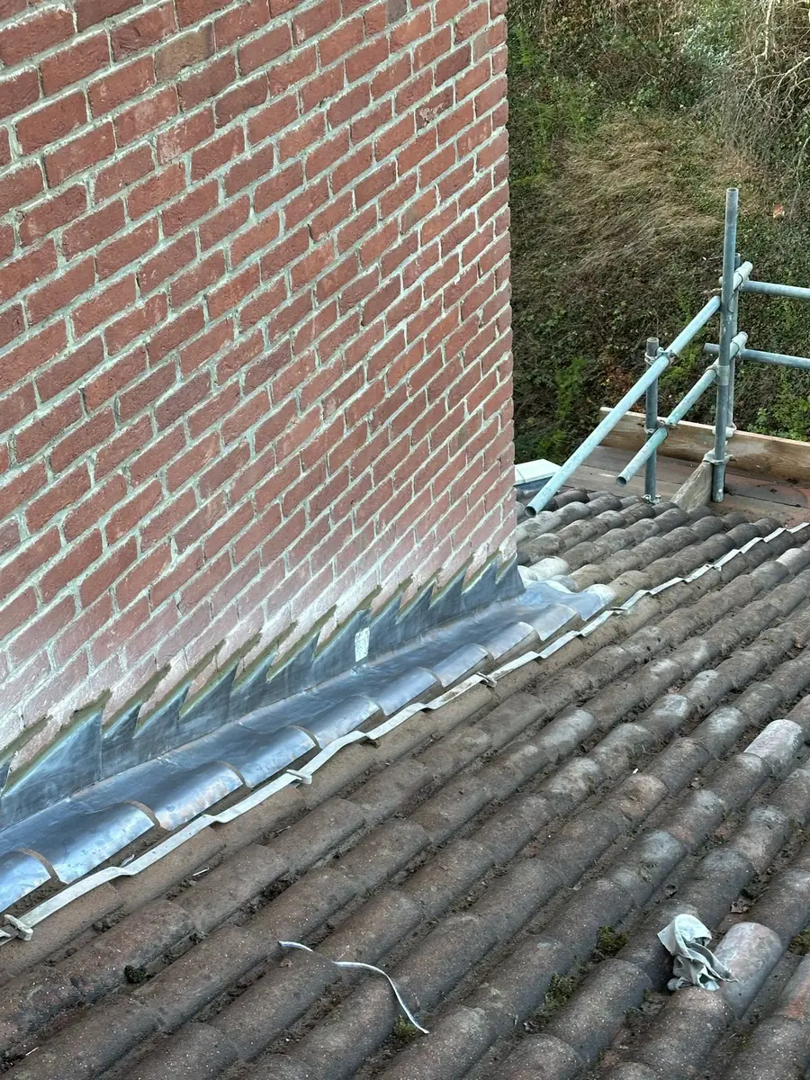 Lead flashing at a chimney on a tiled roof