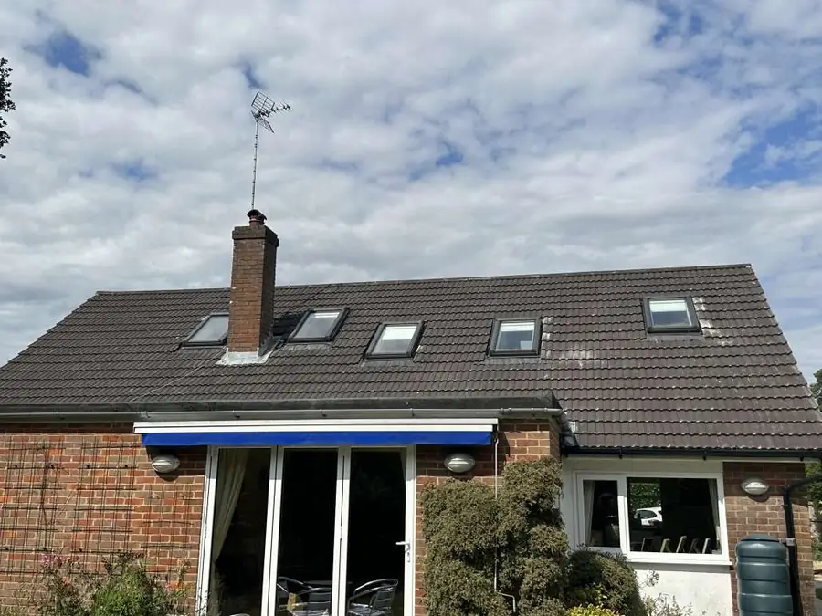 Detached house with a finished tiled roof and new roof windows
