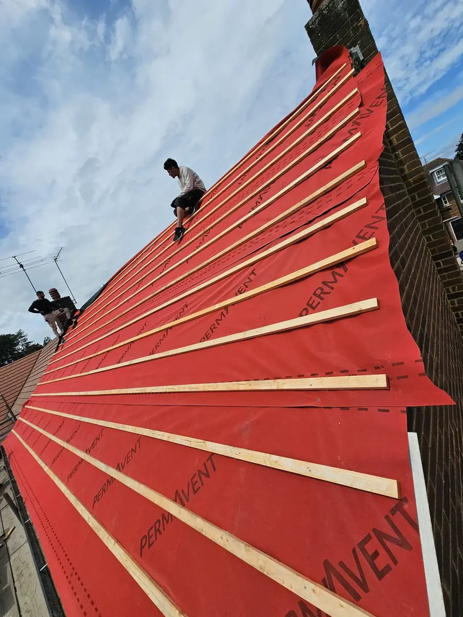 Red breathable membrane and battens on a gable roof