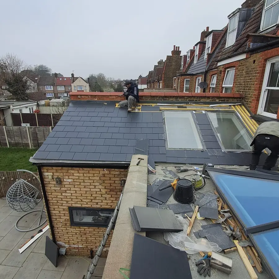 Slate roof with rooflights on a rear extension