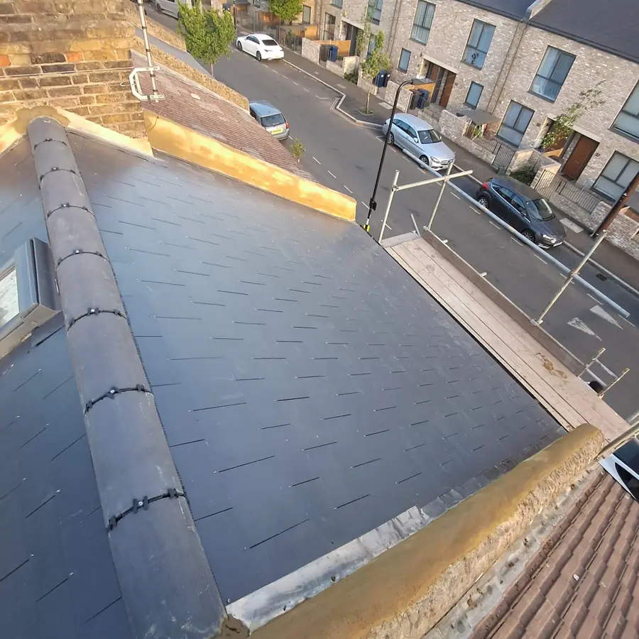 Slate hip roof finished above a street of terraces