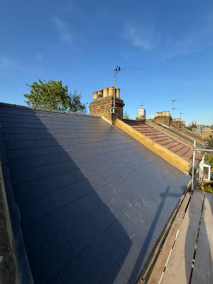 New slate roof against a blue sky