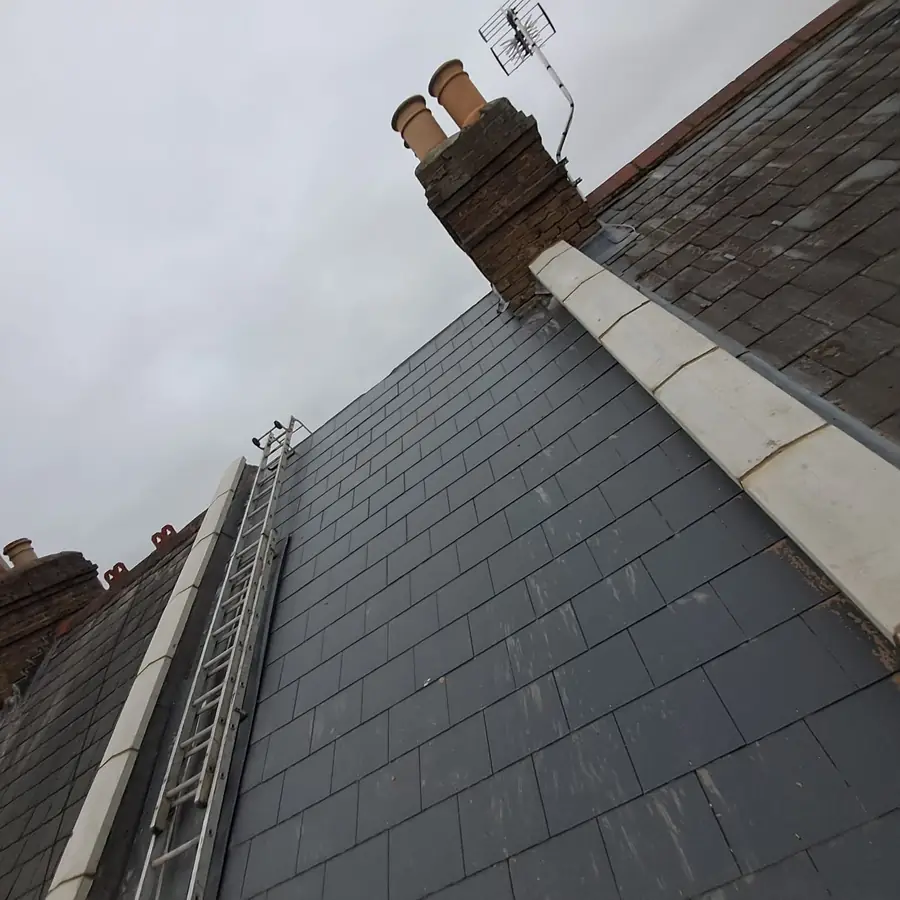 Slate roof with a chimney and lead flashing