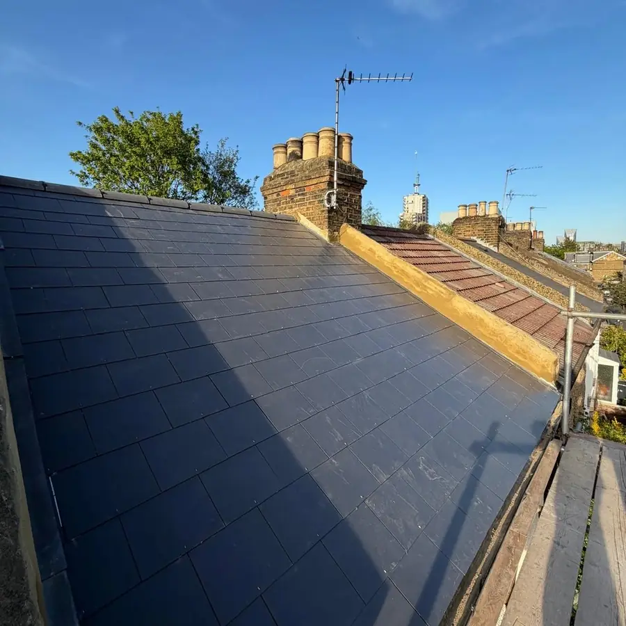 New slate roof with a chimney stack