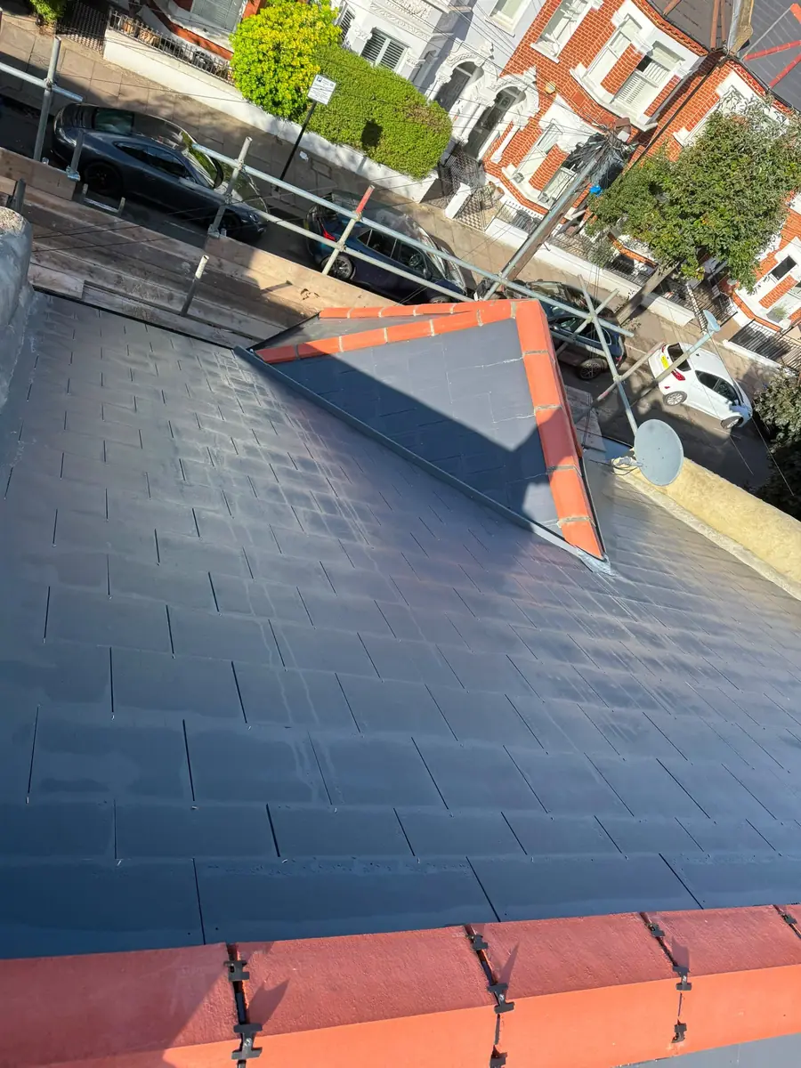New slate roof on a scaffolded terrace
