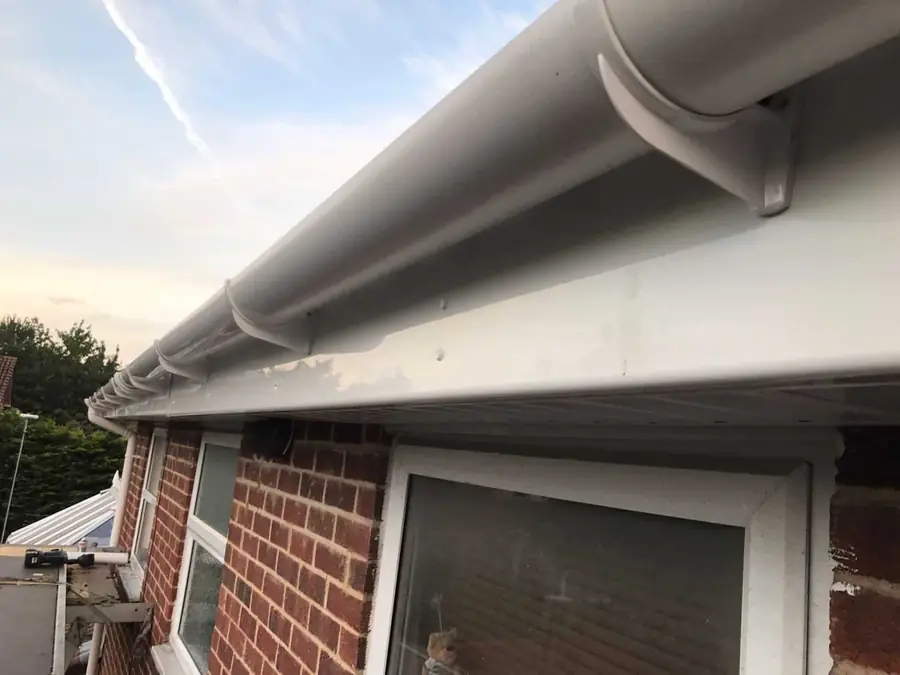 New white uPVC fascia, soffit and gutter seen from below