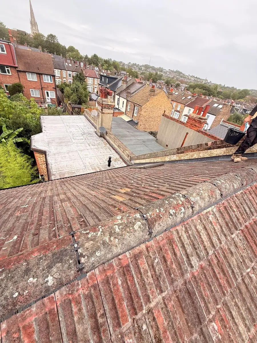 Old red tile roof on a terrace before re-roofing